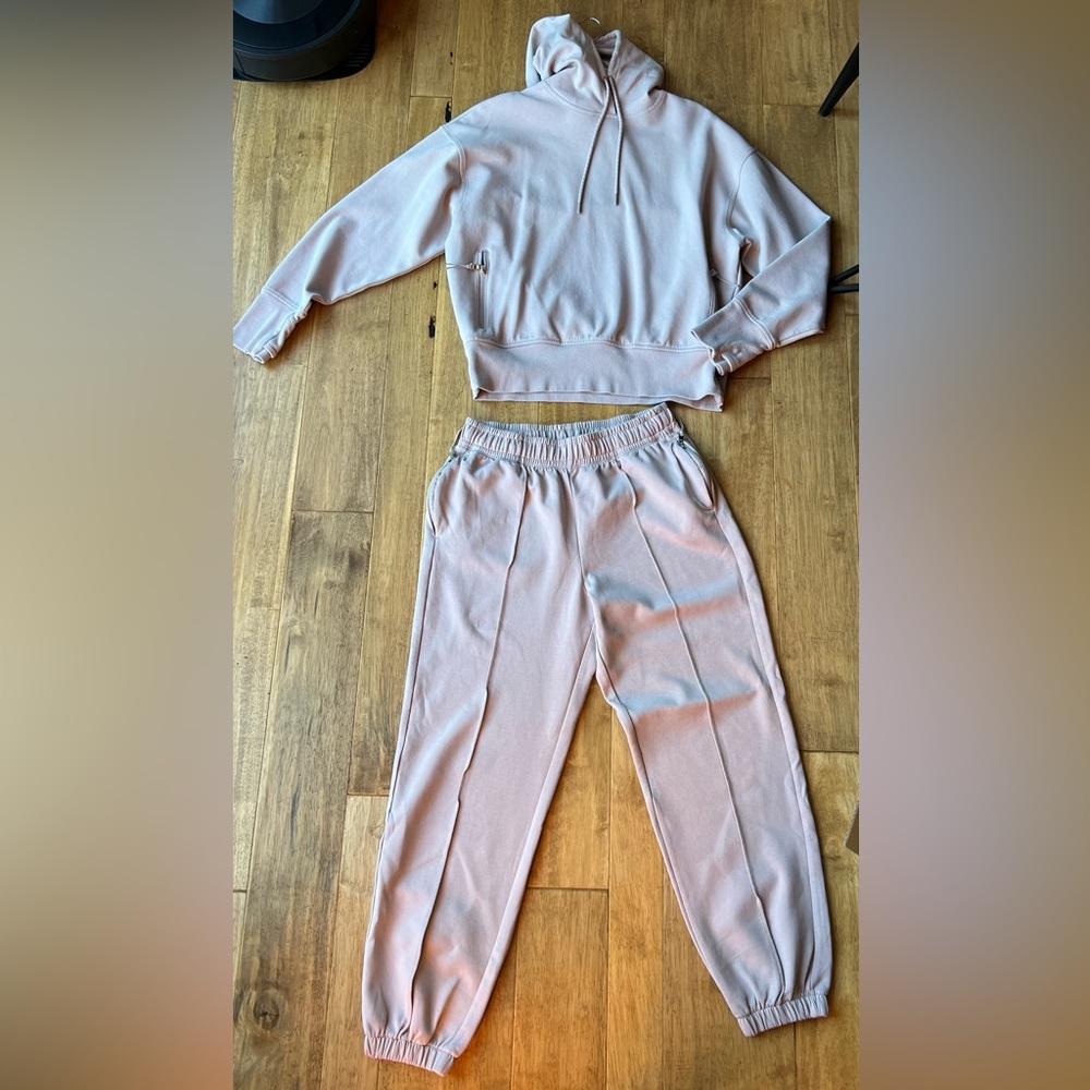 Hoodie size L, sweats S. I am 5’ 3” 145lbs pants a bit baggy, hoodie fits great.